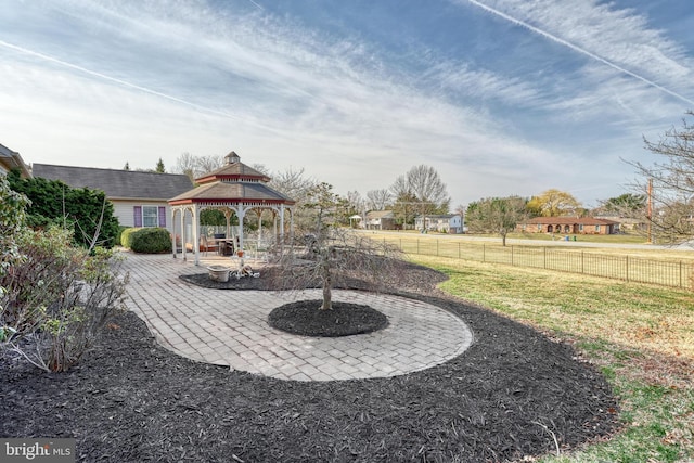 view of yard featuring a gazebo, fence, and a patio