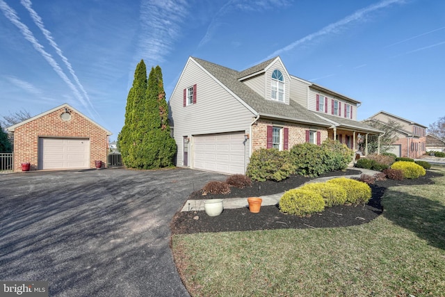 view of property exterior featuring brick siding, a shingled roof, central AC, a garage, and driveway