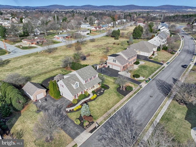 birds eye view of property with a mountain view and a residential view