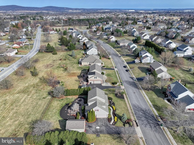 aerial view featuring a mountain view and a residential view