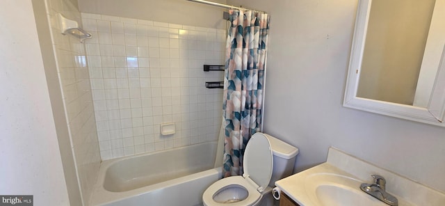 bathroom featuring vanity, shower / tub combo, and toilet