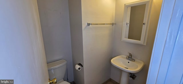 bathroom with a sink and toilet