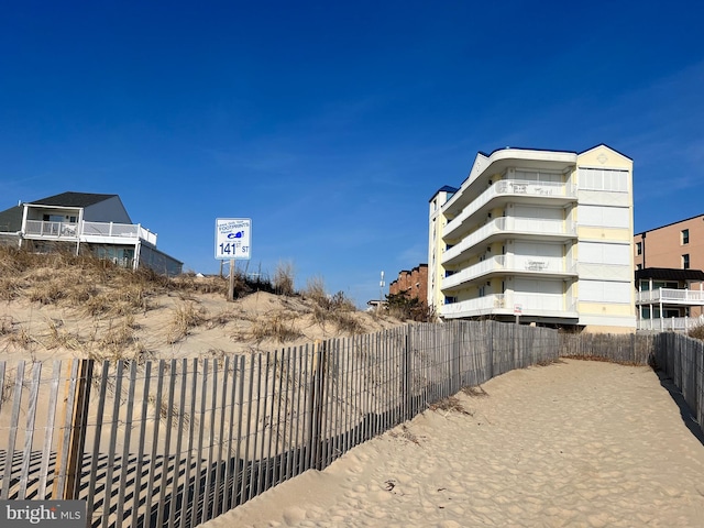 view of property with fence