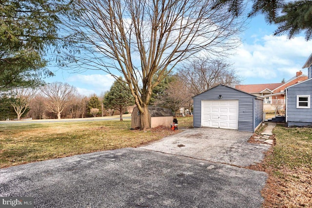 detached garage with aphalt driveway