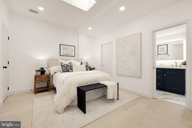 bedroom with visible vents, recessed lighting, a skylight, and connected bathroom