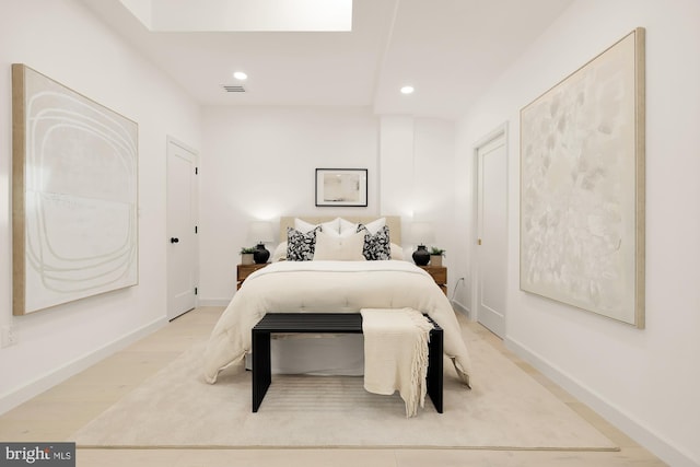 bedroom featuring recessed lighting, visible vents, baseboards, and wood finished floors