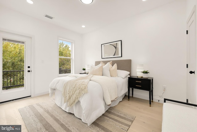 bedroom featuring visible vents, recessed lighting, light wood-style floors, and access to outside