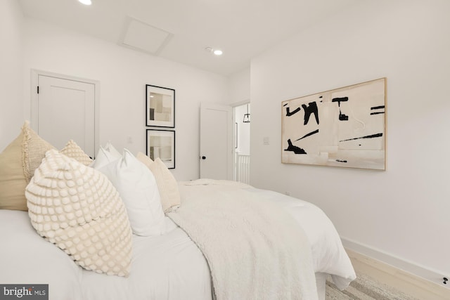 bedroom featuring attic access, recessed lighting, wood finished floors, and baseboards