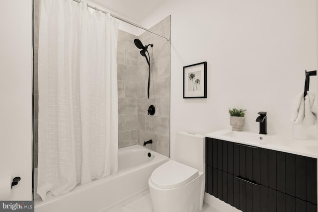 bathroom featuring a sink, shower / bath combo with shower curtain, toilet, and marble finish floor