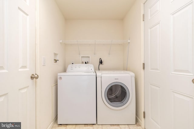 laundry room with washing machine and dryer and laundry area