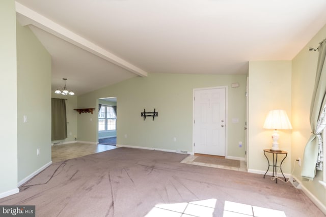 carpeted empty room featuring a chandelier, visible vents, vaulted ceiling with beams, and baseboards