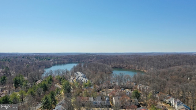 bird's eye view featuring a view of trees and a water view