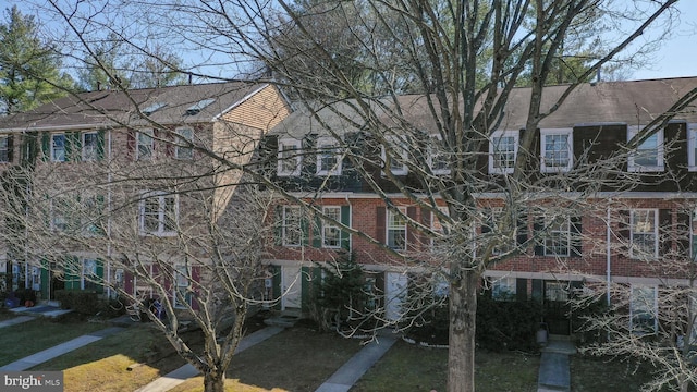 multi unit property featuring brick siding