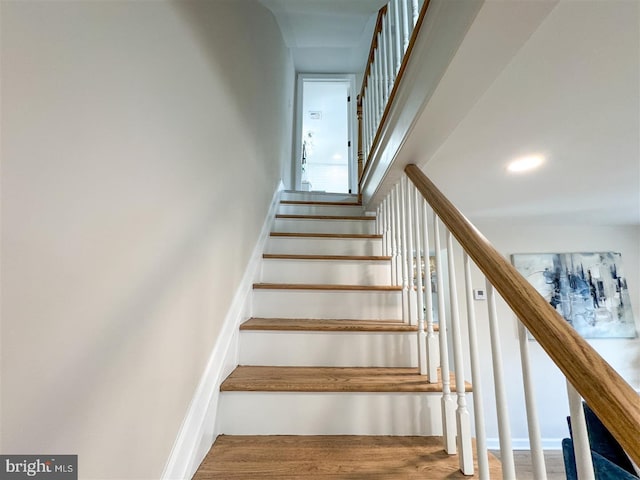 stairs featuring recessed lighting and baseboards