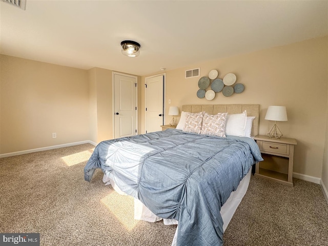 bedroom with visible vents, baseboards, and carpet flooring