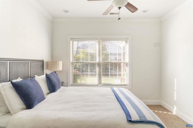 bedroom with visible vents, crown molding, baseboards, and carpet floors