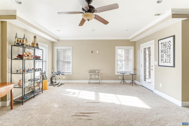 misc room featuring visible vents, baseboards, ornamental molding, and carpet flooring