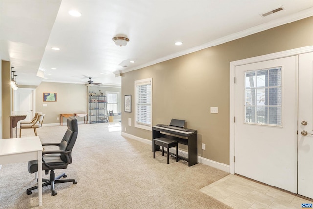 office space featuring visible vents, baseboards, light colored carpet, and ornamental molding