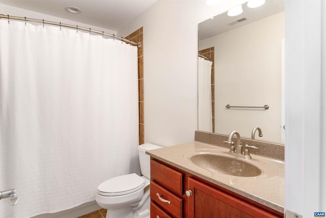 bathroom with vanity, toilet, a shower with curtain, and visible vents