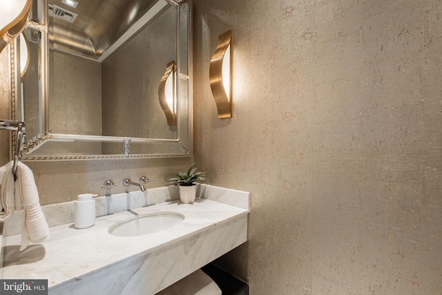 bathroom with a sink and visible vents