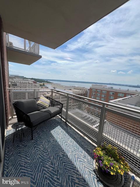 balcony featuring a water view