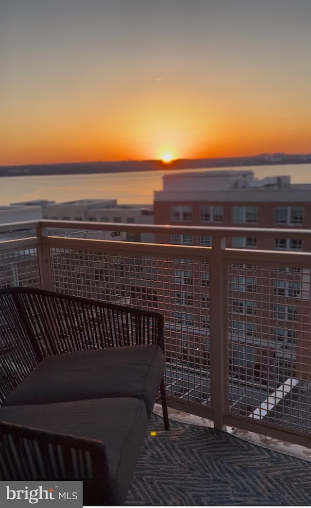 balcony featuring a water view