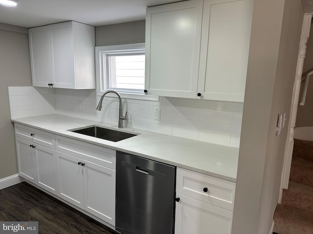 kitchen featuring a sink, white cabinets, decorative backsplash, and stainless steel dishwasher