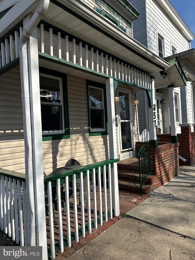 property entrance featuring covered porch