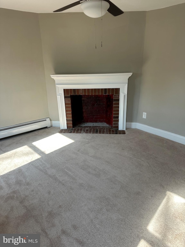 unfurnished living room with a brick fireplace, a baseboard heating unit, baseboards, carpet flooring, and a ceiling fan