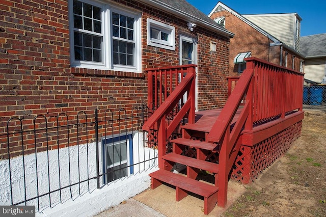 doorway to property with brick siding