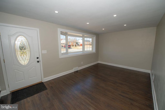 foyer entrance featuring dark wood-style floors, visible vents, recessed lighting, and baseboards