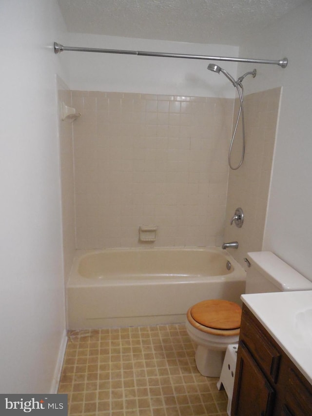 bathroom with vanity, toilet, shower / bathtub combination, and a textured ceiling