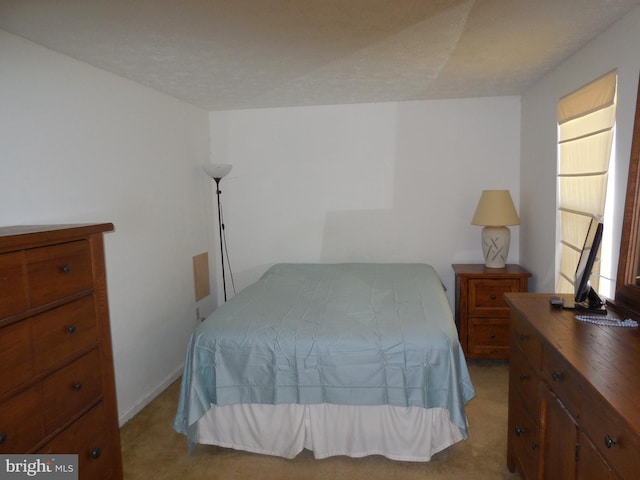 bedroom with light carpet