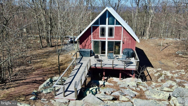 view of outdoor structure featuring a forest view