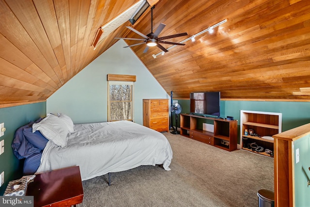 bedroom featuring a ceiling fan, wooden ceiling, rail lighting, carpet flooring, and vaulted ceiling