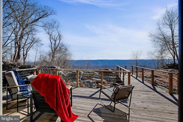 wooden terrace with a mountain view