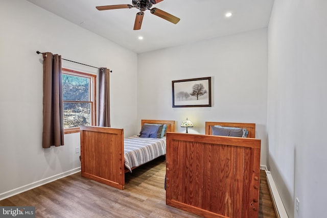 bedroom with recessed lighting, wood finished floors, baseboards, and ceiling fan