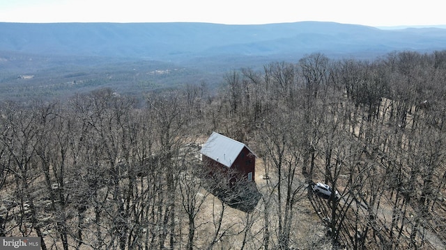 bird's eye view with a mountain view and a wooded view