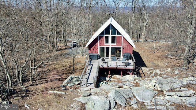 view of outdoor structure with a view of trees