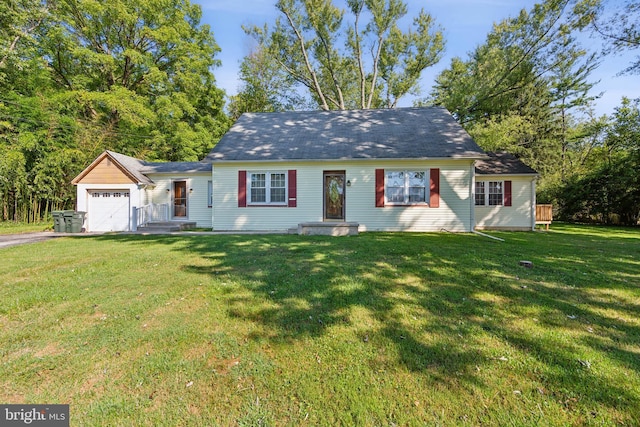 cape cod-style house with driveway, a front lawn, and a garage