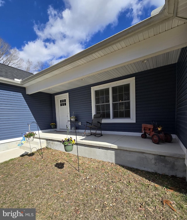 property entrance featuring a porch