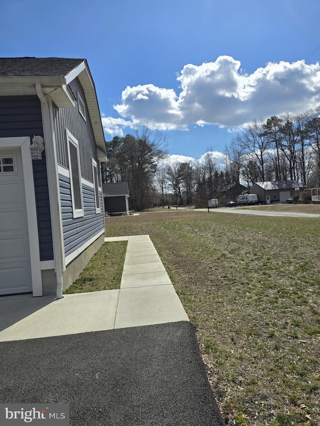 view of yard featuring a garage