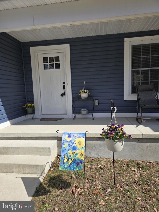 doorway to property with a porch