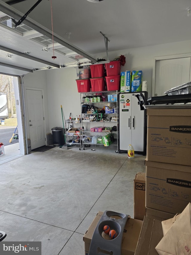 garage featuring freestanding refrigerator