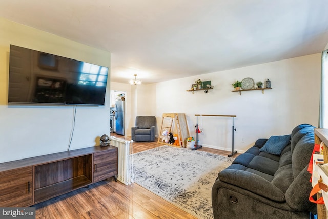 living room featuring baseboards and wood finished floors