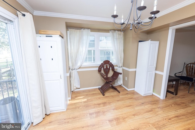 interior space with baseboards, light wood-type flooring, crown molding, and an inviting chandelier