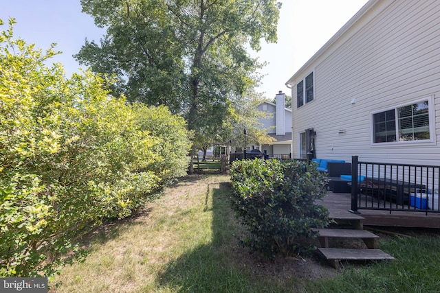 view of yard with a wooden deck