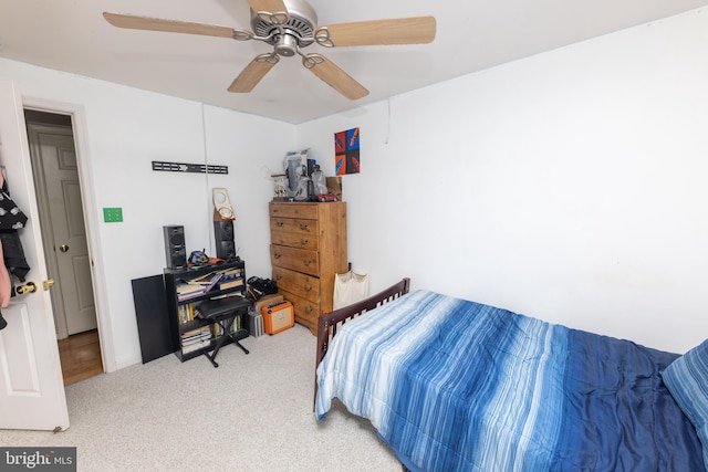 carpeted bedroom featuring a ceiling fan