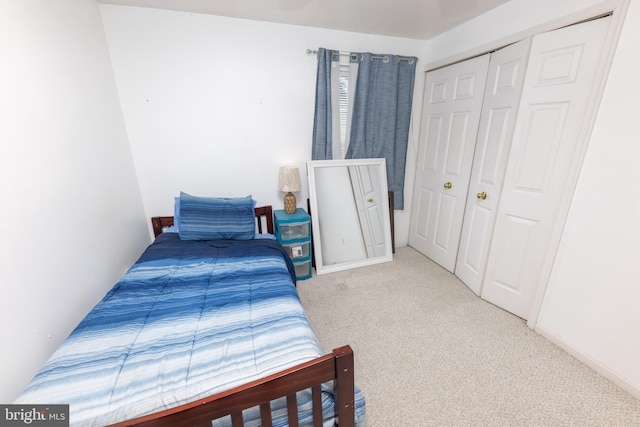 bedroom with a closet and carpet floors