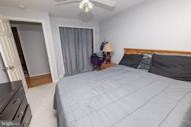 bedroom featuring baseboards and ceiling fan